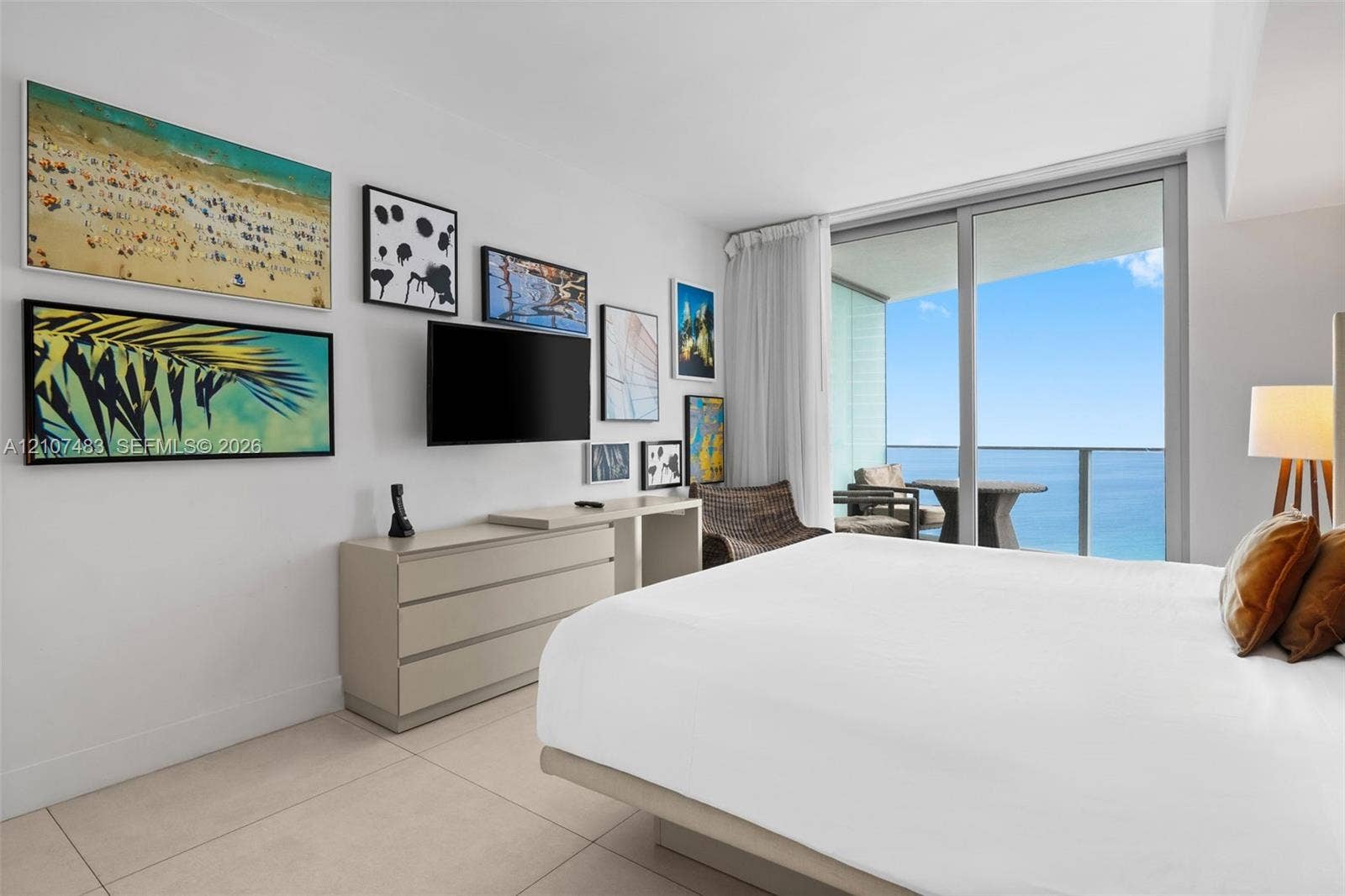 4111 S Ocean Drive, #2407, Hollywood, FL 33019 Floor-to-ceiling sliding glass doors, private balcony, large format tile flooring, and neutral wall palette