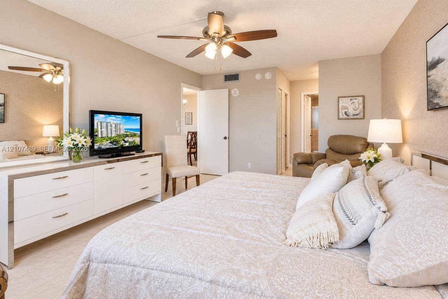 2000 S Ocean Boulevard, #9N, Lauderdale-By-The-Sea, Lauderdale By The Sea, FL 33062 Bedroom featuring neutral wall paint, tile flooring, and a ceiling fan with integrated lighting
