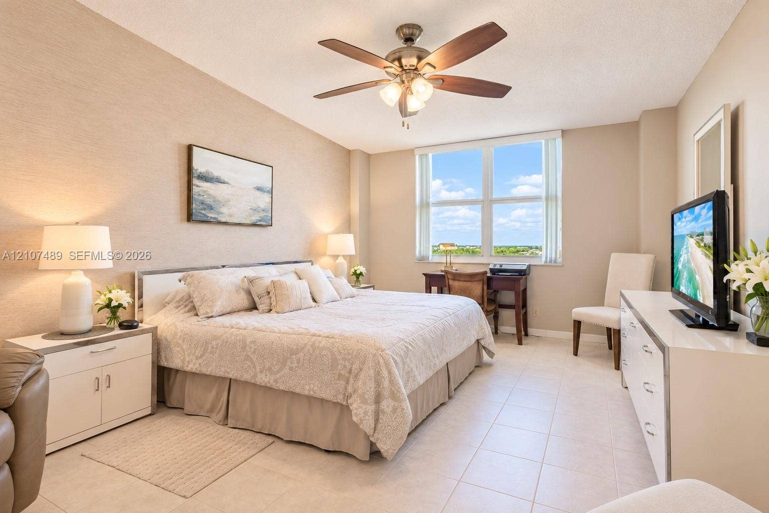 2000 S Ocean Boulevard, #9N, Lauderdale-By-The-Sea, Lauderdale By The Sea, FL 33062 Spacious interior featuring large windows, neutral wall finishes, tile flooring, and a ceiling fan with integrated lighting