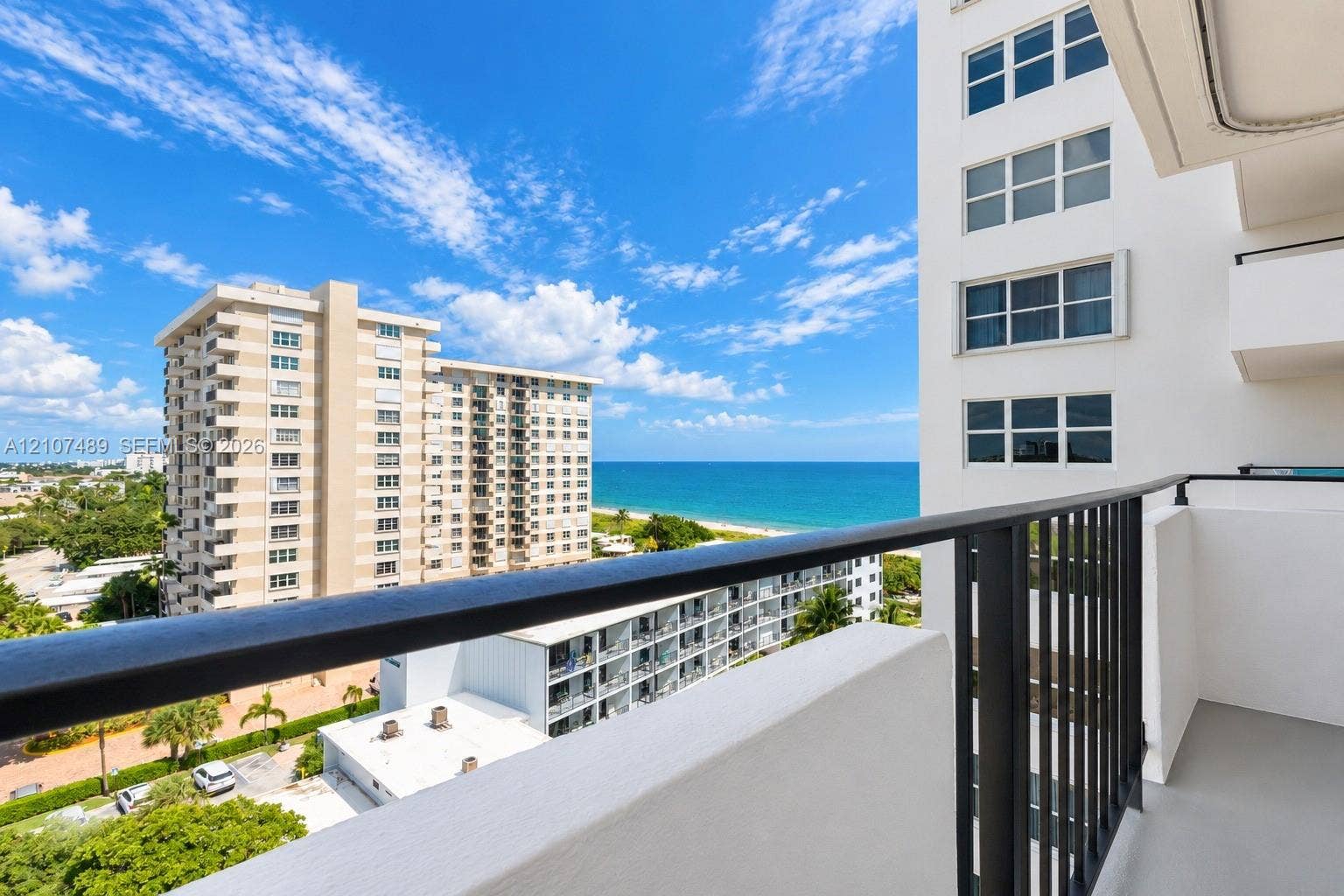 2000 S Ocean Boulevard, #9N, Lauderdale-By-The-Sea, Lauderdale By The Sea, FL 33062 Covered balcony featuring metal railings and concrete flooring with an expanse of ocean and coastline