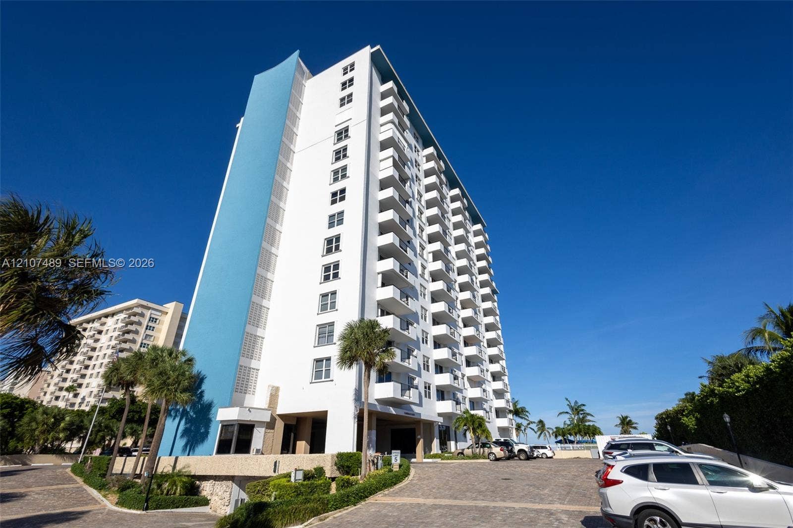 2000 S Ocean Boulevard, #9N, Lauderdale-By-The-Sea, Lauderdale By The Sea, FL 33062 High-rise building featuring a blue accent facade, white exterior finish, and uniform private balconies