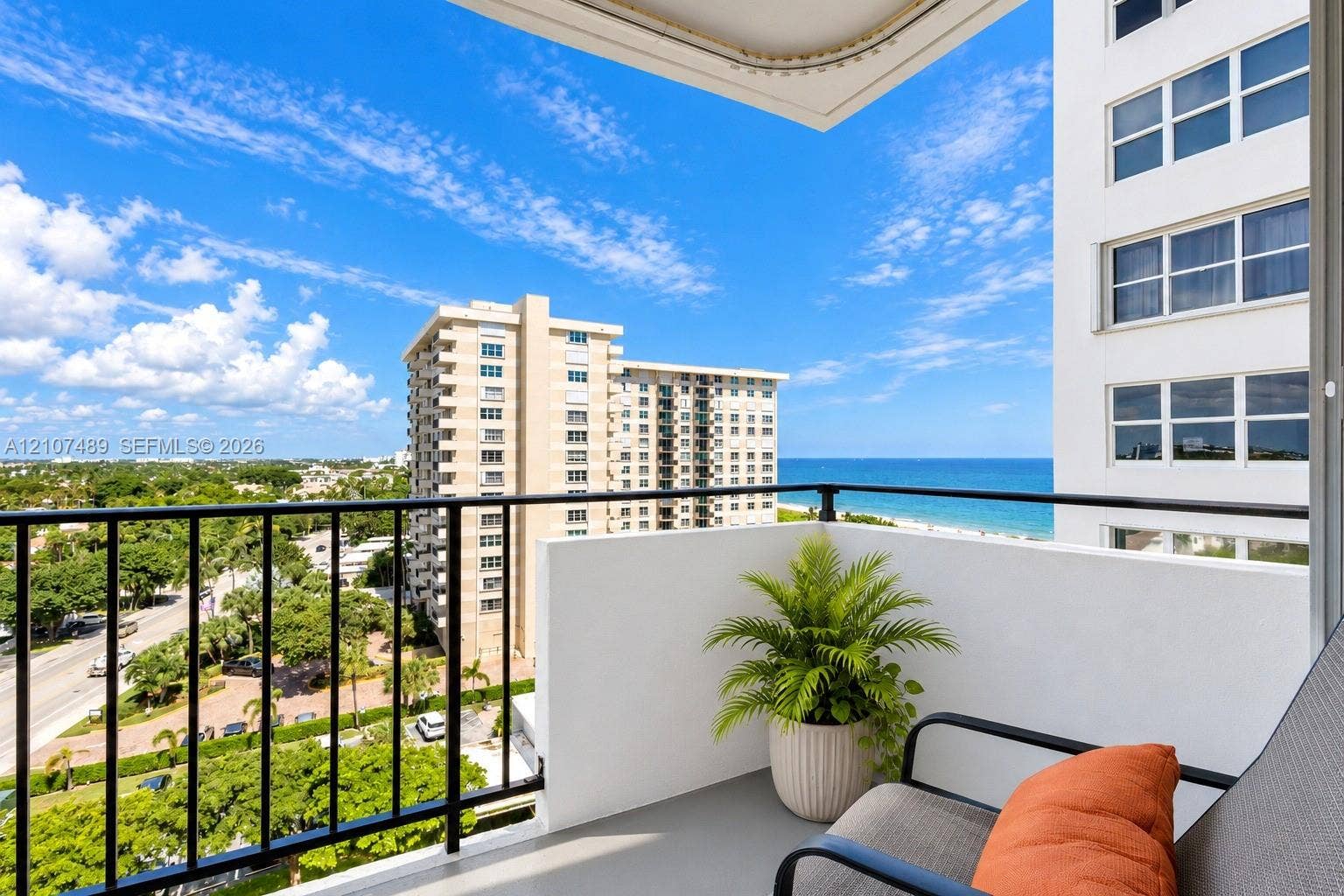 2000 S Ocean Boulevard, #9N, Lauderdale-By-The-Sea, Lauderdale By The Sea, FL 33062 Private balcony featuring black metal railings, solid partition walls, and expansive ocean and coastal scenery