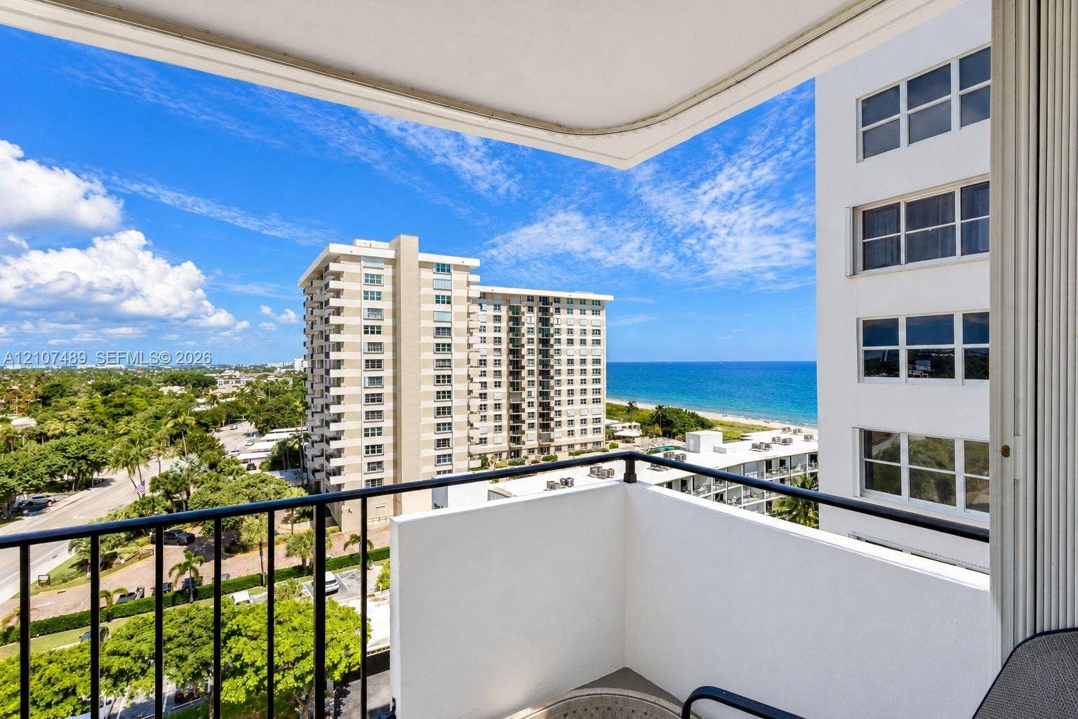 2000 S Ocean Boulevard, #9N, Lauderdale-By-The-Sea, Lauderdale By The Sea, FL 33062 Private balcony with black metal railing overlooking the oceanfront and coastal landscape