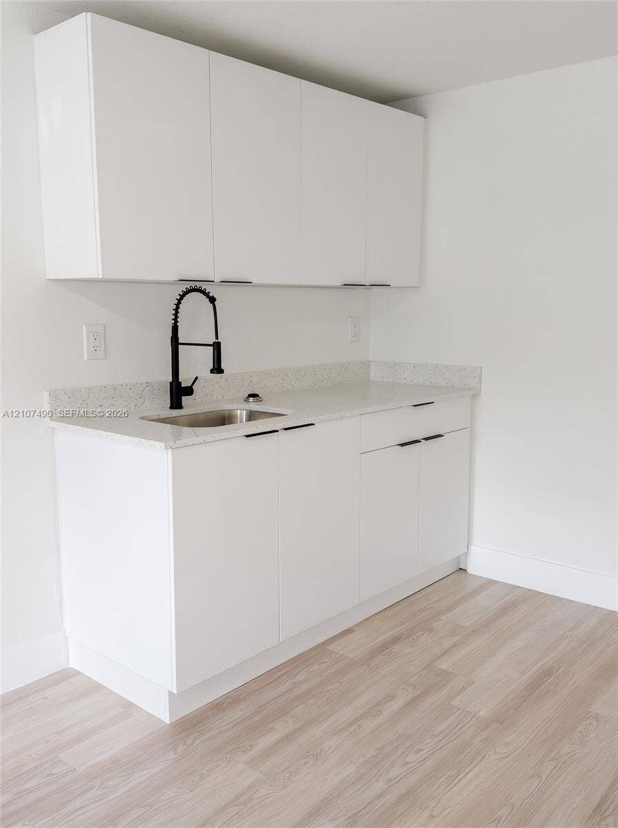 Fridge, hot plate & microwave being installed.