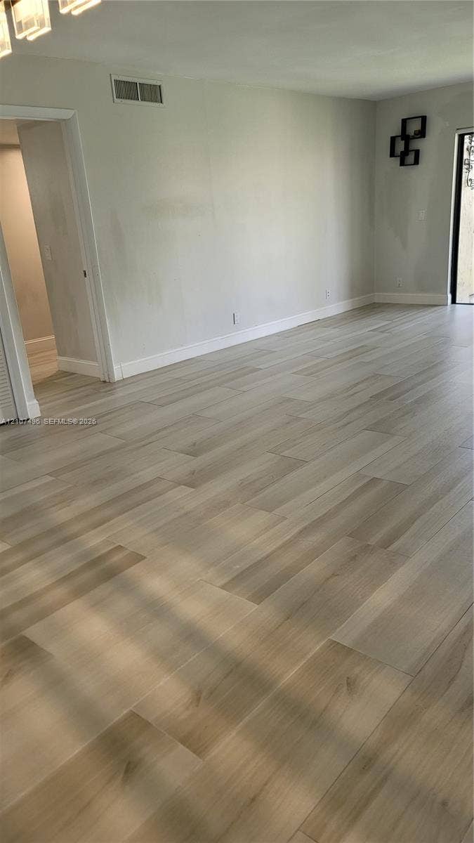 330 Racquet Club Road, #204, Weston, Weston, FL 33326 Neutral wall finishes, light wood-finish flooring, and recessed ceiling lighting