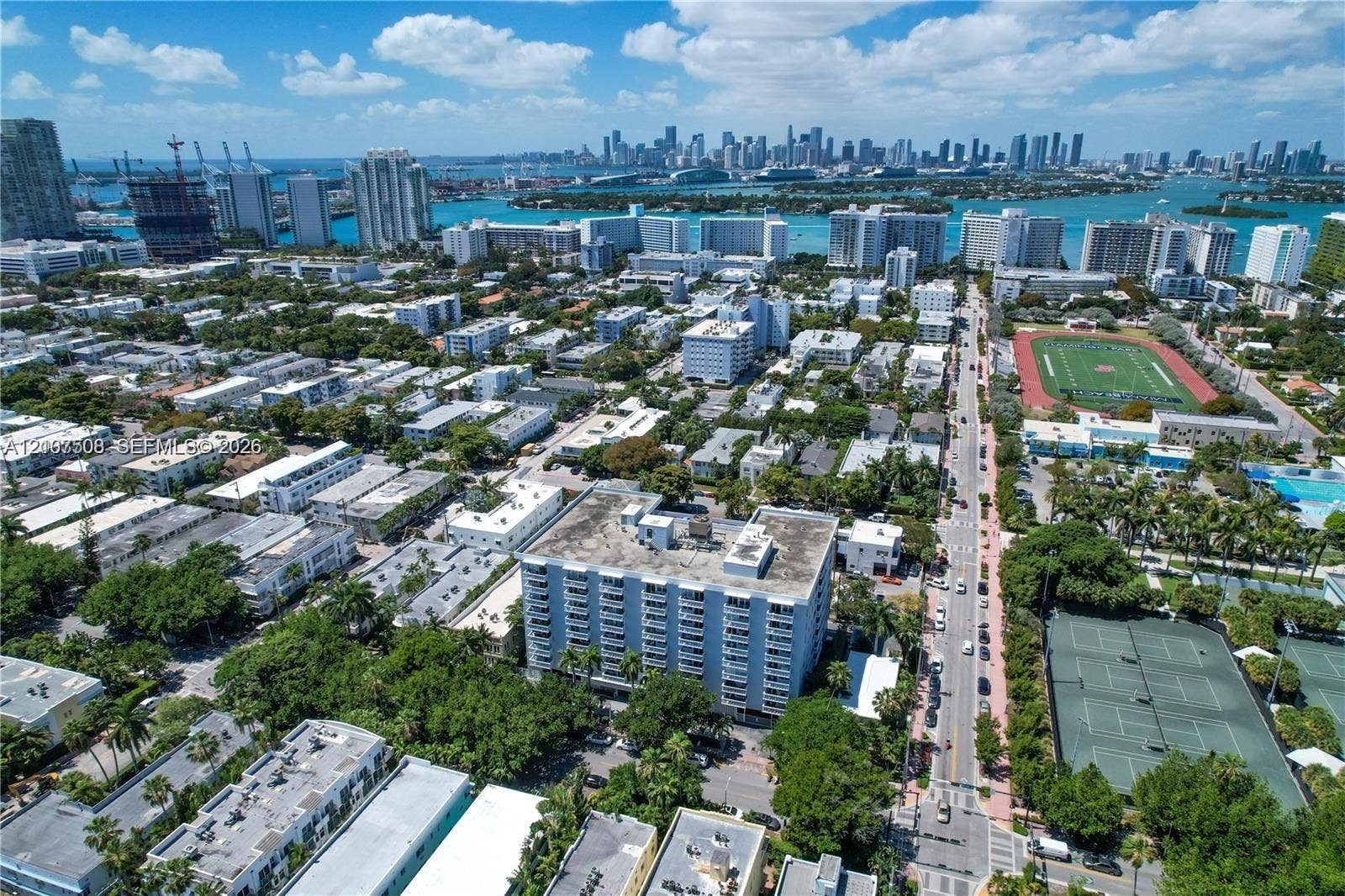 1020 Meridian Avenue, #415, Miami Beach, Miami Beach, FL 33139 Aerial perspective of a multi-story residential building featuring private balconies and proximity to municipal tennis courts and athletic fields
