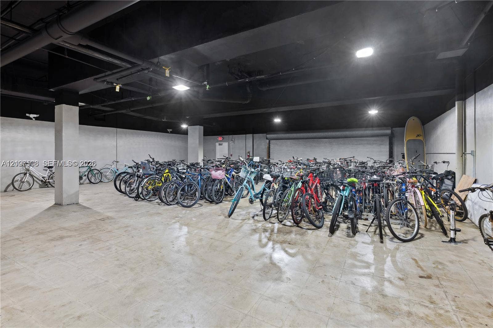 1020 Meridian Avenue, #415, Miami Beach, Miami Beach, FL 33139 Expansive storage area featuring concrete flooring, overhead industrial-style lighting, and structural support columns