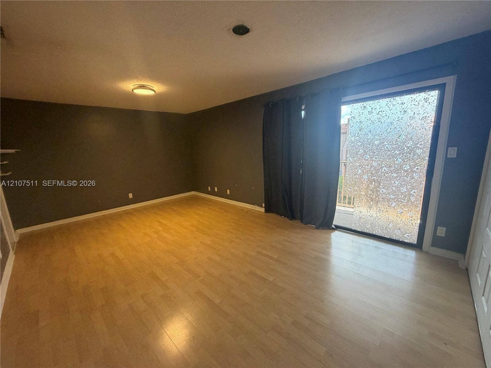 12 S Valencia Drive, #5-4, Davie, FL 33324 Wood-finish flooring, recessed ceiling lighting, and sliding glass door with textured privacy pane
