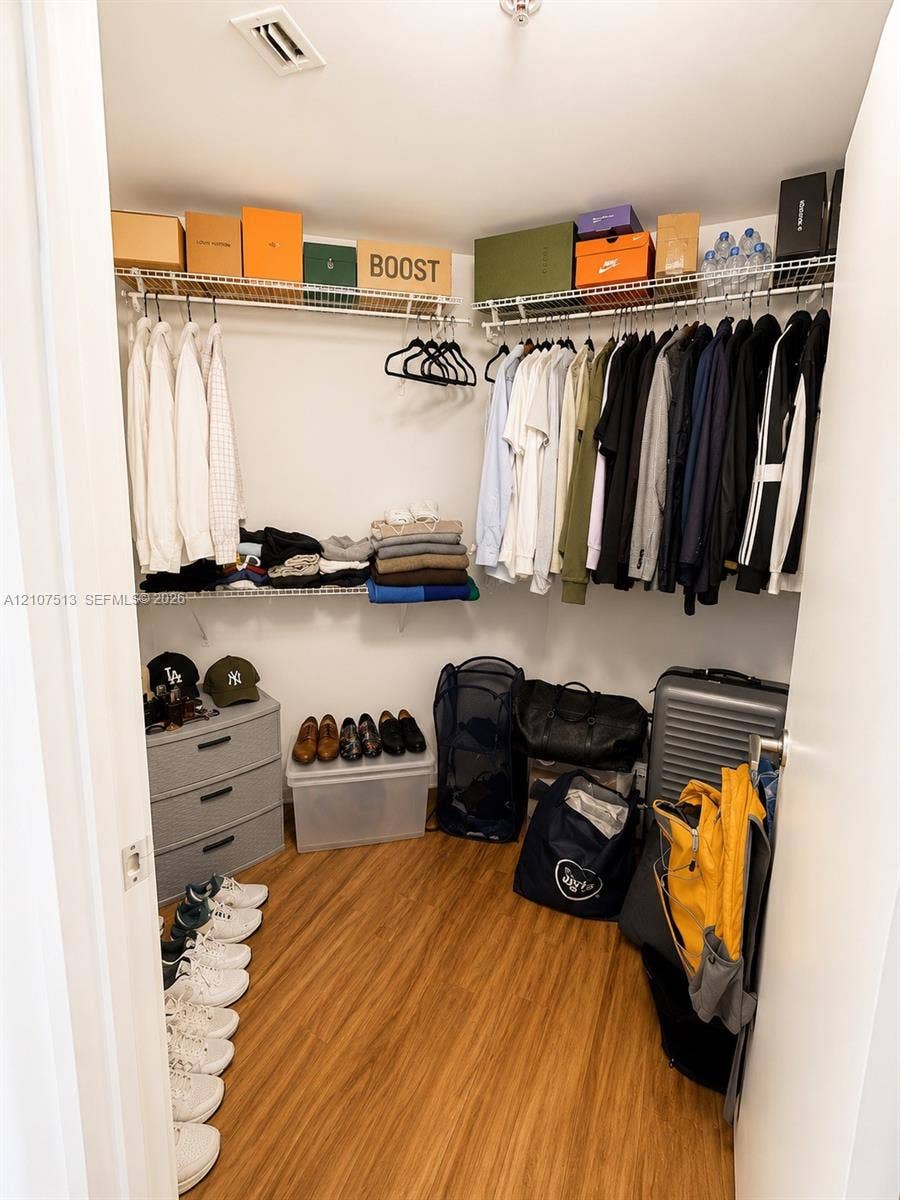 1900 N Bayshore Drive, #3005, Miami, FL 33132 Walk-in closet featuring wood-finish flooring and dual-level wire shelving
