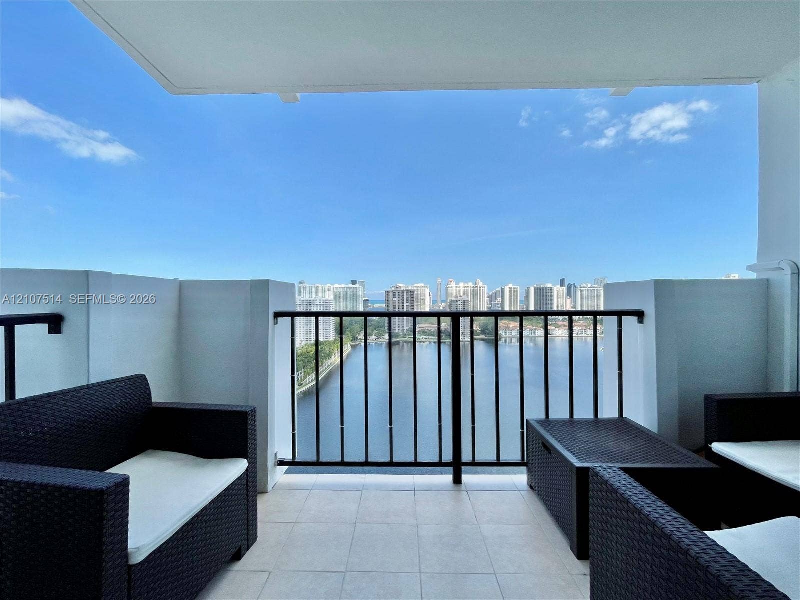 2750 NE 183rd Street, #2310, Aventura, Aventura, FL 33160 Private balcony featuring tiled flooring, solid wall partitions, and a black metal railing