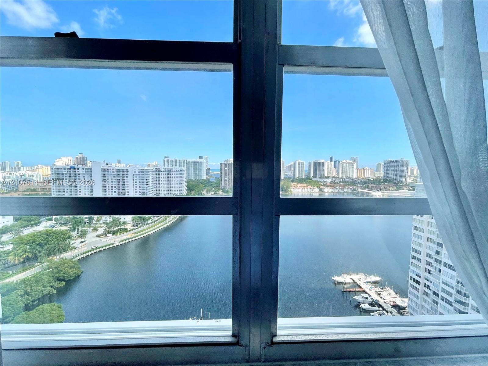 2750 NE 183rd Street, #2310, Aventura, Aventura, FL 33160 Large-format metal-framed windows featuring expansive water and urban skyline scenery
