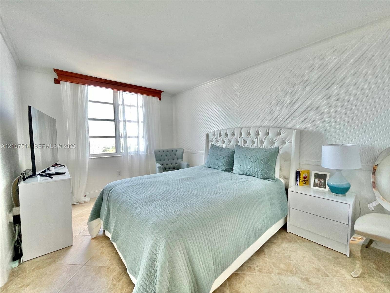2750 NE 183rd Street, #2310, Aventura, Aventura, FL 33160 Neutral tile flooring and white chevron-patterned accent wall paneling