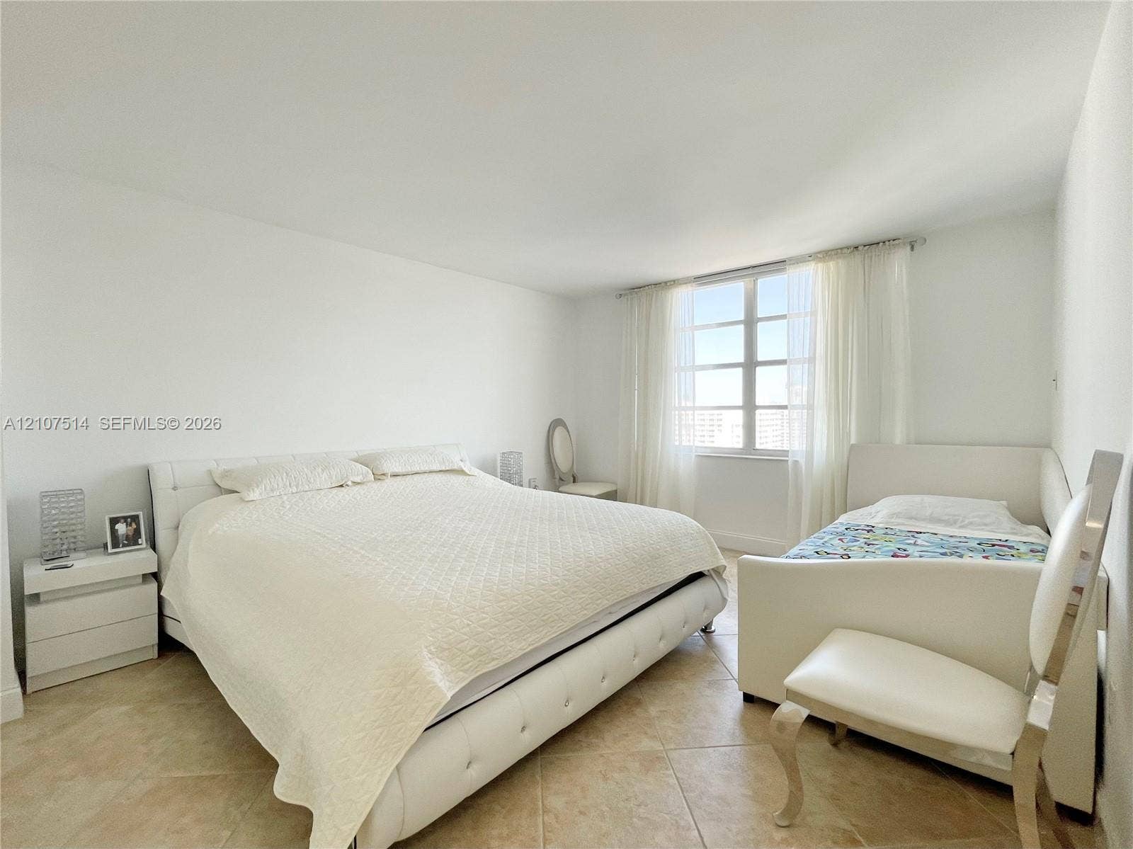 2750 NE 183rd Street, #2310, Aventura, Aventura, FL 33160 Room featuring neutral walls, large multi-pane windows, and light-toned tile flooring