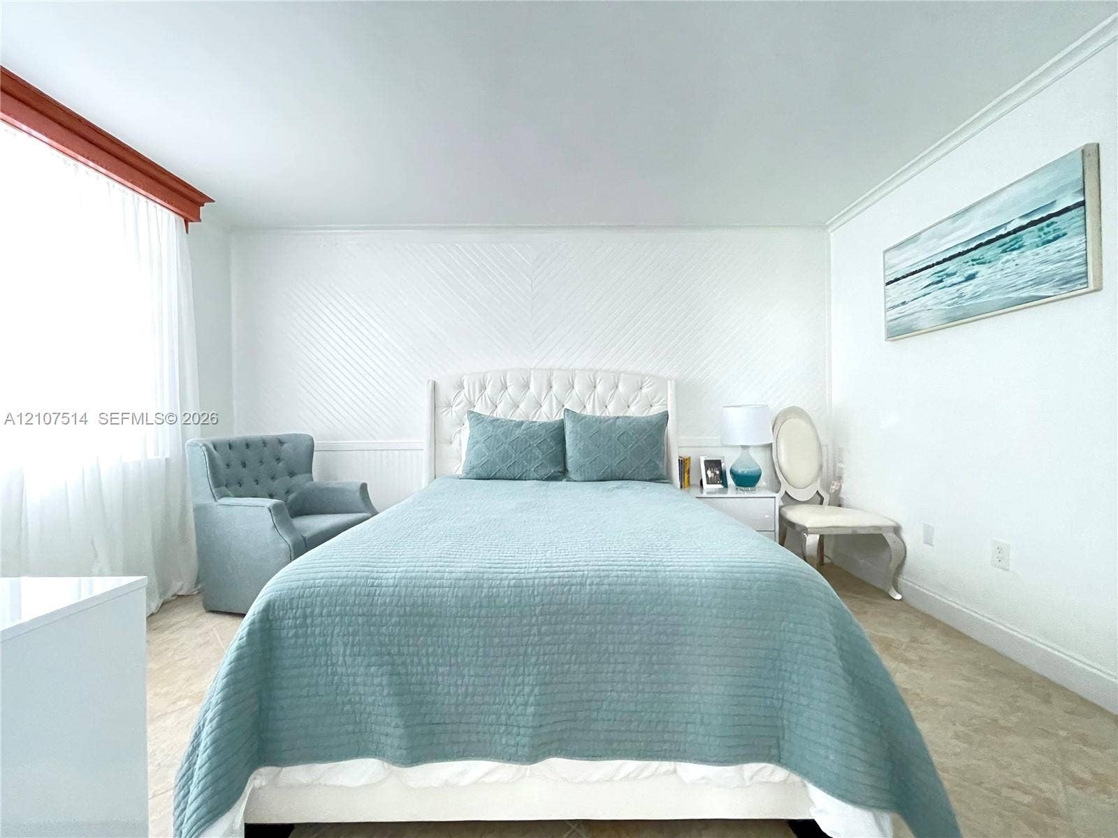 2750 NE 183rd Street, #2310, Aventura, Aventura, FL 33160 Room featuring chevron-patterned wainscoting, neutral tile flooring, and crown molding