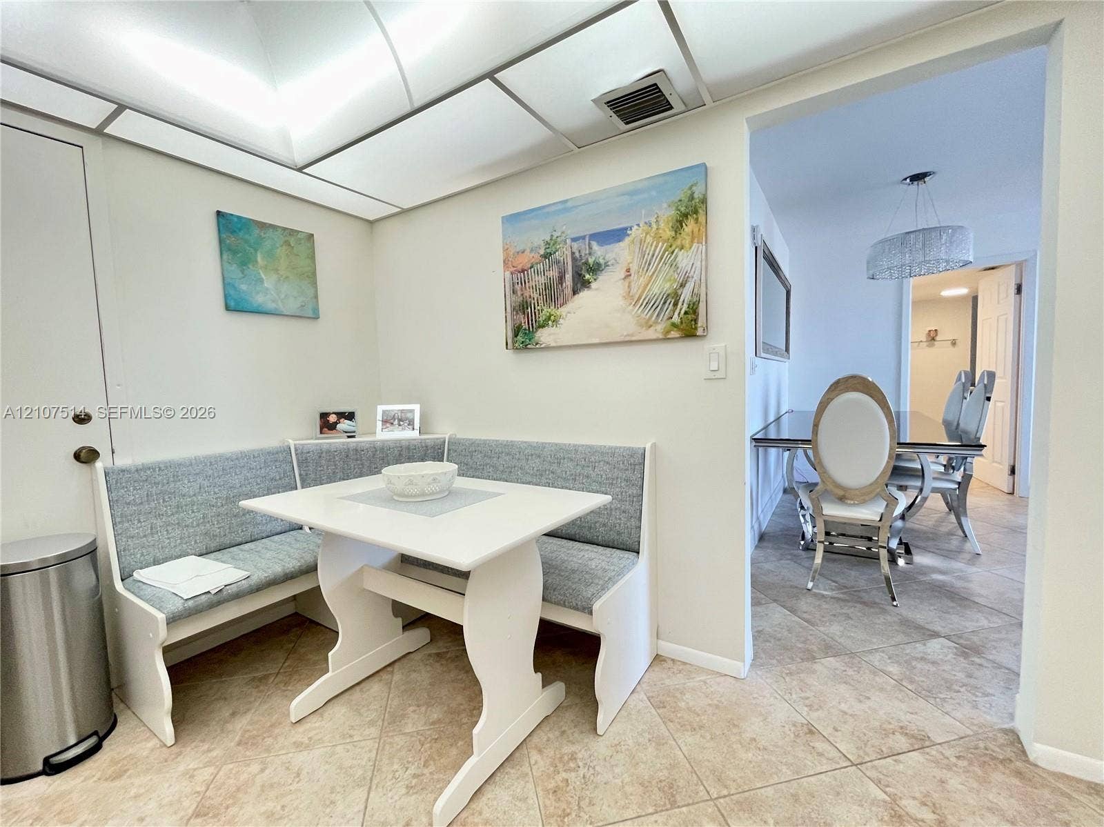 2750 NE 183rd Street, #2310, Aventura, Aventura, FL 33160 Built-in corner bench seating with neutral upholstery and tile flooring