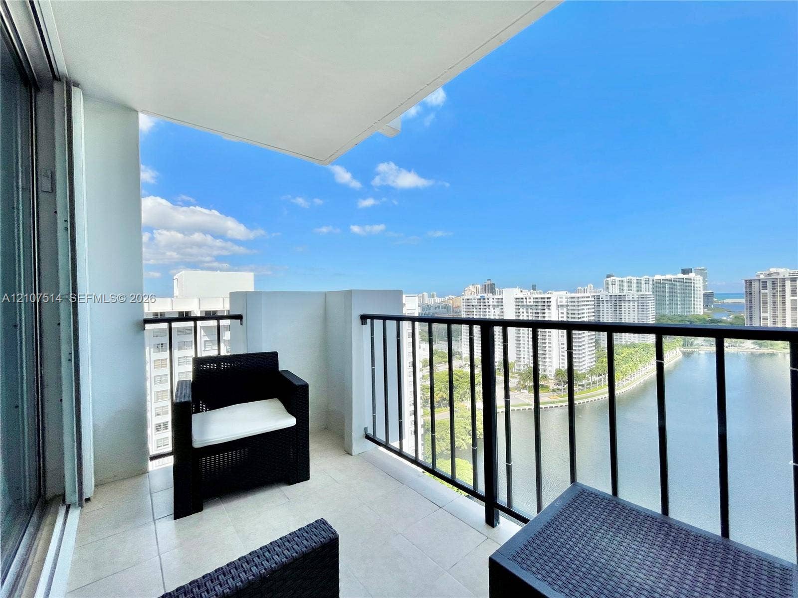 2750 NE 183rd Street, #2310, Aventura, Aventura, FL 33160 Covered balcony featuring tile flooring and a black metal railing