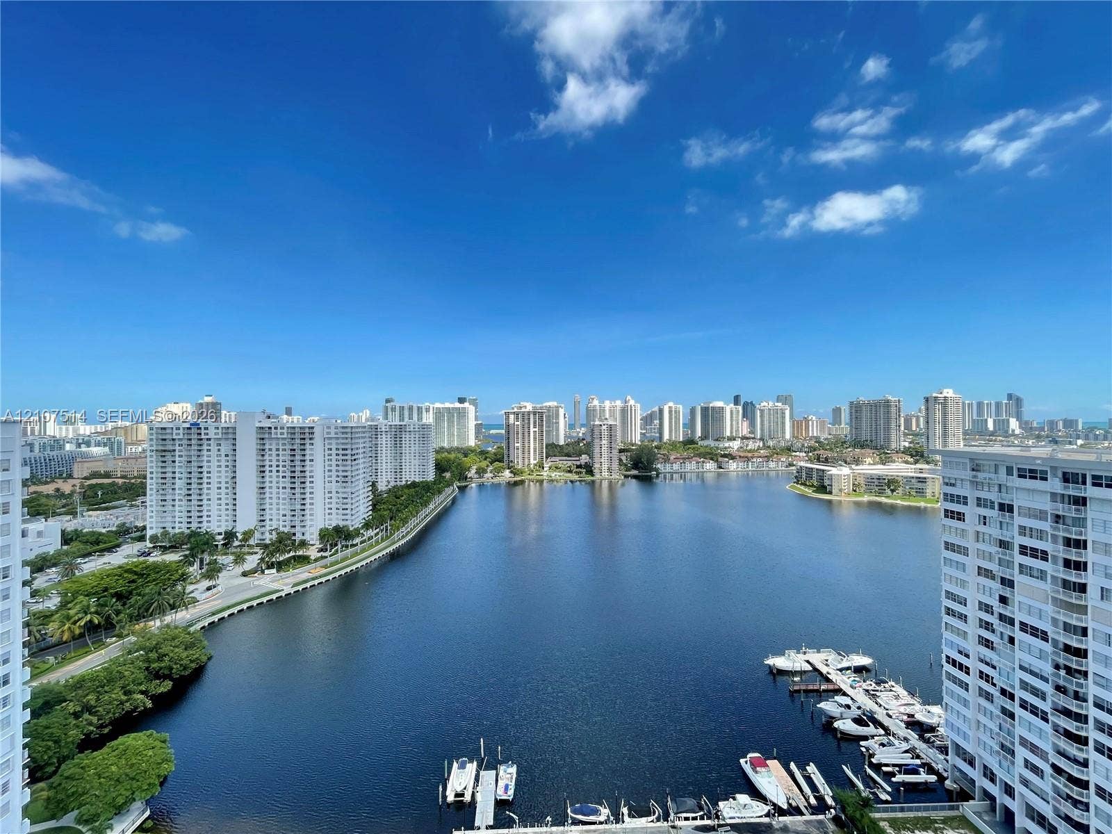 2750 NE 183rd Street, #2310, Aventura, Aventura, FL 33160 Panoramic water perspective featuring a marina with docking slips and a distant urban skyline