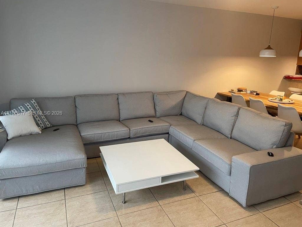 16531 NE 35th Avenue, #402-11, North Miami Beach, FL 33160 large living room fits huge sectionals with plenty of space for everyone