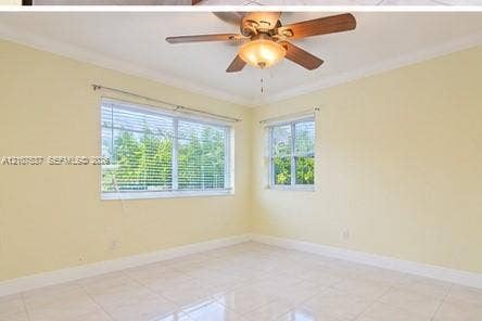 Room featuring light-toned tile flooring, crown molding, a central ceiling fan with integrated light fixture, and dual windows with horizontal blinds