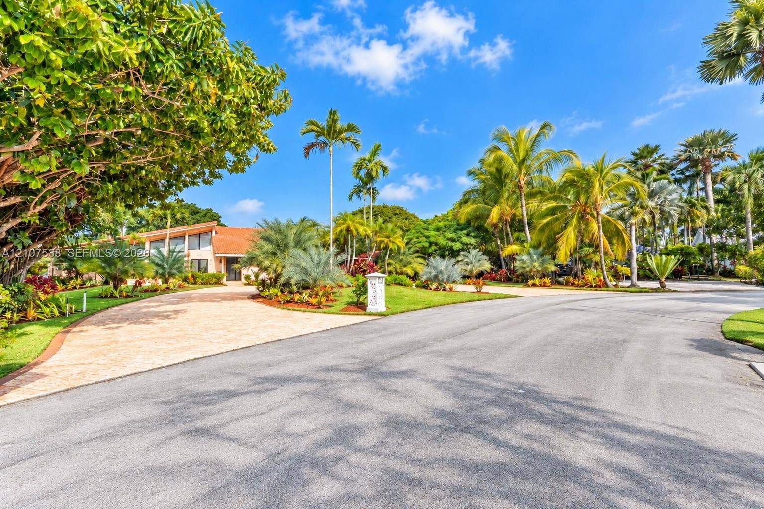 10204 SW 96th Court, Miami, Miami, FL 33176 Paver stone driveway, clay tile roofing, and mature tropical landscaping