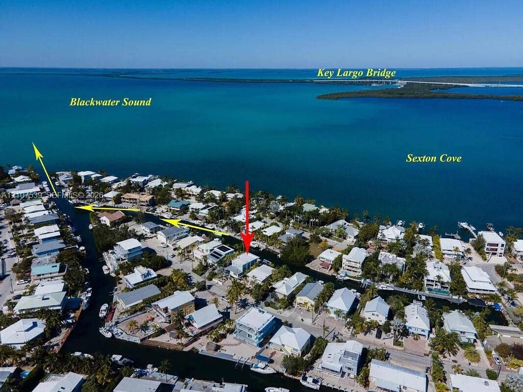 20 Center Lane, Key Largo, FL 33037 Aerial perspective of waterfront property situated on a canal with direct access to Blackwater Sound and Sexton Cove