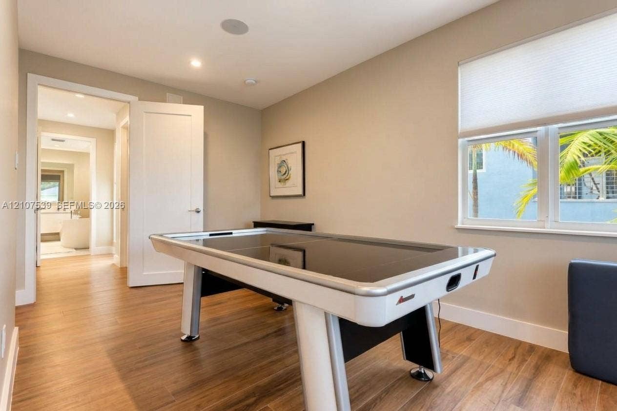 20 Center Lane, Key Largo, FL 33037 Wood-finish flooring, recessed lighting, multi-pane windows with integrated cellular shades, and neutral wall tones