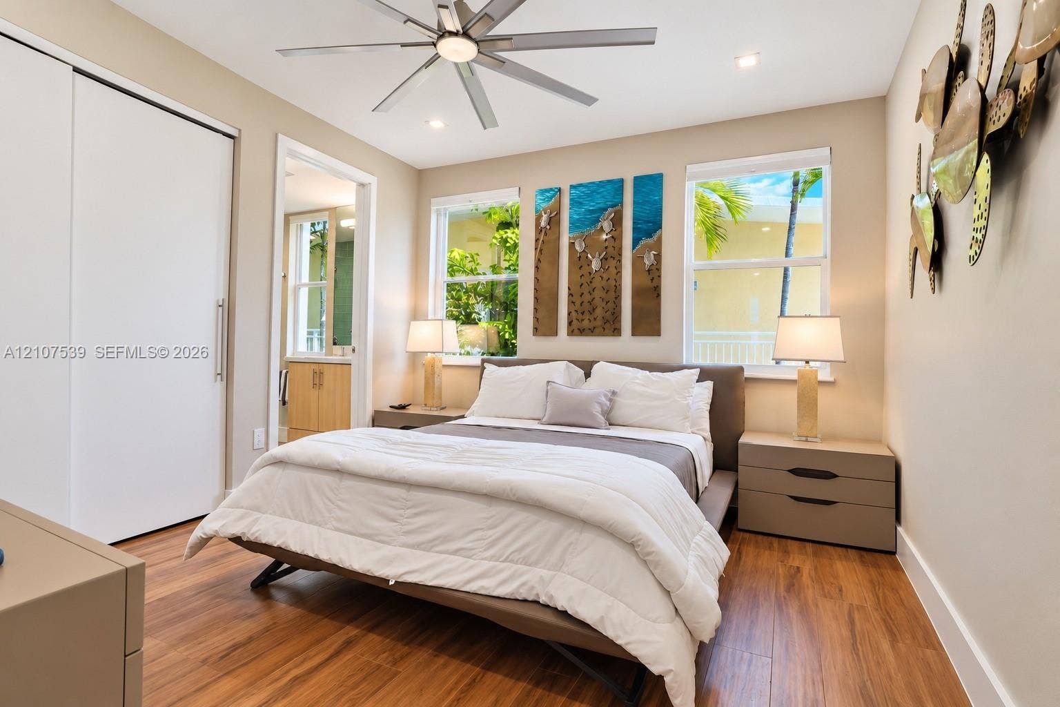 20 Center Lane, Key Largo, FL 33037 Wood-finish flooring, recessed lighting, ceiling fan, sliding closet doors, and windows with exterior greenery