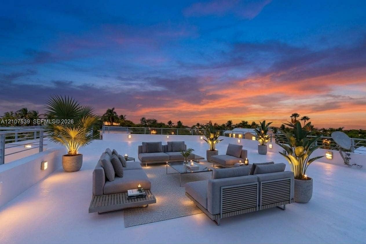 20 Center Lane, Key Largo, FL 33037 Expansive rooftop terrace featuring a smooth-finish deck, metal perimeter railing, and integrated wall-mounted lighting