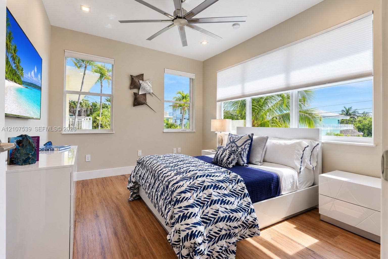 20 Center Lane, Key Largo, FL 33037 Room featuring wood-finish flooring, a multi-blade ceiling fan, recessed lighting, and large windows with integrated shades