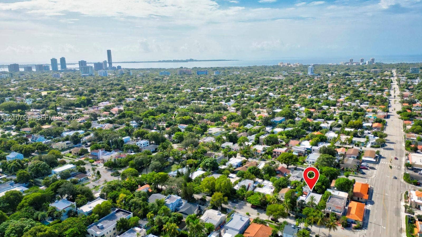 1676 SW 11th Street, Miami, Miami, FL 33135 Aerial perspective featuring dense canopy coverage and proximity to the urban skyline and waterfront