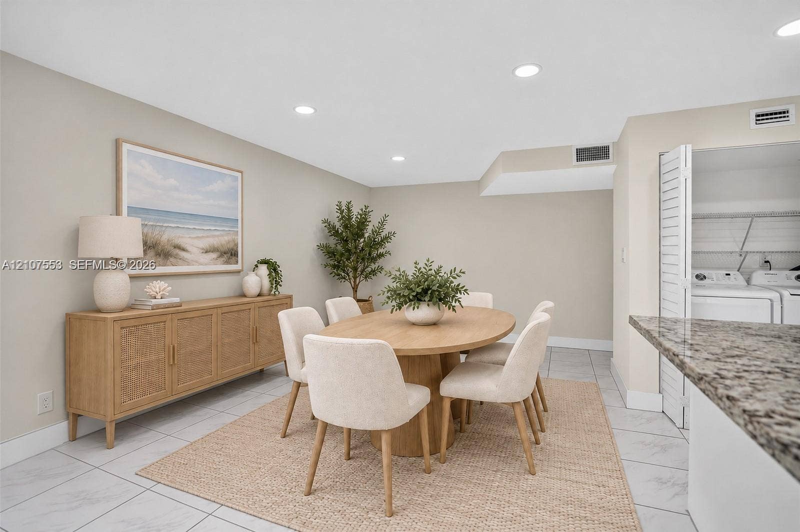 7336 SW 26th Court, #51, Davie, Davie, FL 33314 Neutral-toned interior featuring recessed lighting, large-format tile flooring, and a dedicated laundry area concealed by louvered closet doors