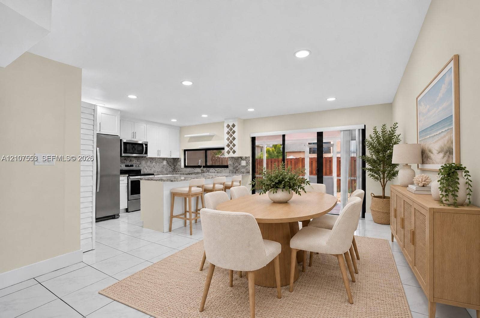 7336 SW 26th Court, #51, Davie, Davie, FL 33314 Kitchen featuring white shaker-style cabinetry, stone-finish countertops, stainless steel appliances, a built-in wine rack, and tile flooring
