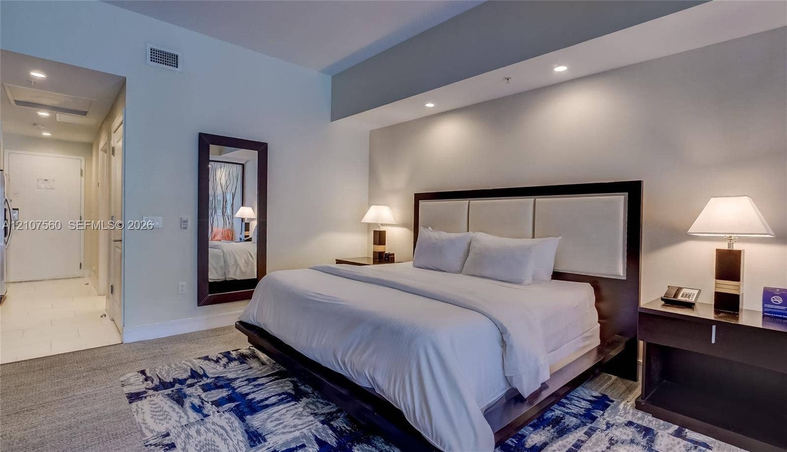 5300 NW 87th Avenue, #407, Doral, FL 33178 High ceilings with recessed lighting, neutral wall finishes, and wall-to-wall carpeting