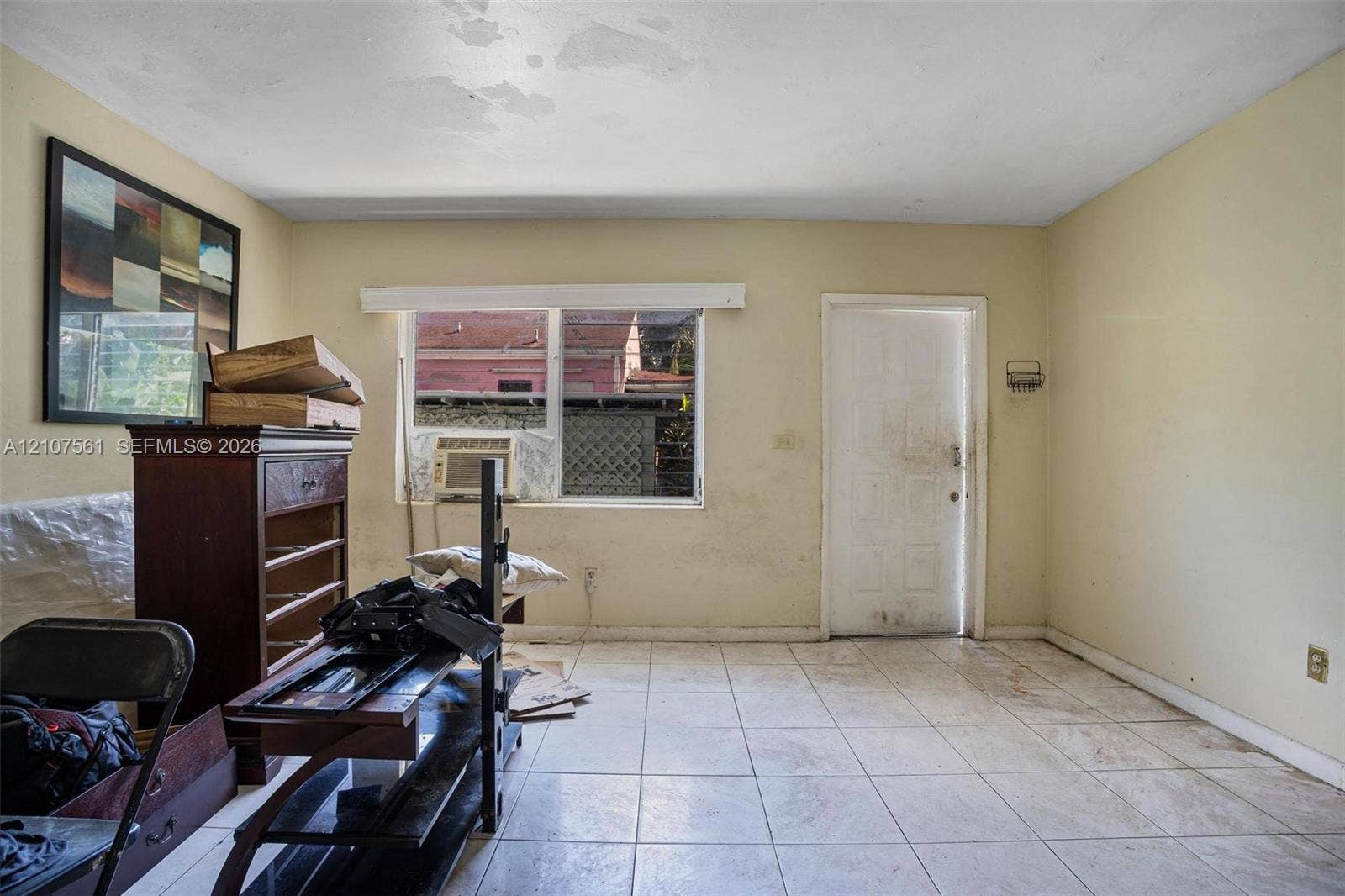 50 NW 69th Street, Miami, FL 33150 Interior room featuring tile flooring and a multi-pane window