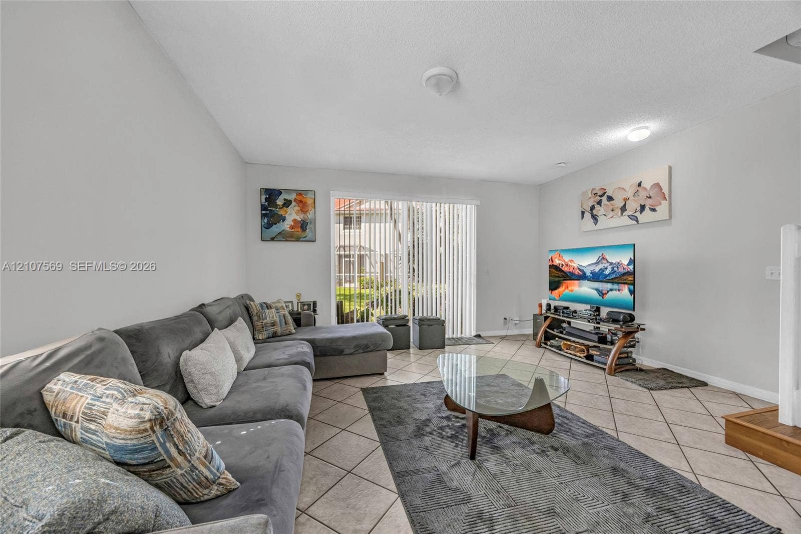 3765 San Simeon Circle, #3765, Weston, Weston, FL 33331 Living area featuring diagonal tile flooring and glass sliding doors