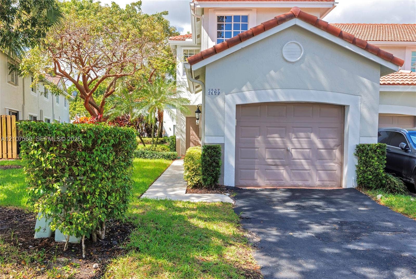 3765 San Simeon Circle, #3765, Weston, Weston, FL 33331 Two-story exterior featuring a clay tile roof, stucco facade, and an attached single-car garage