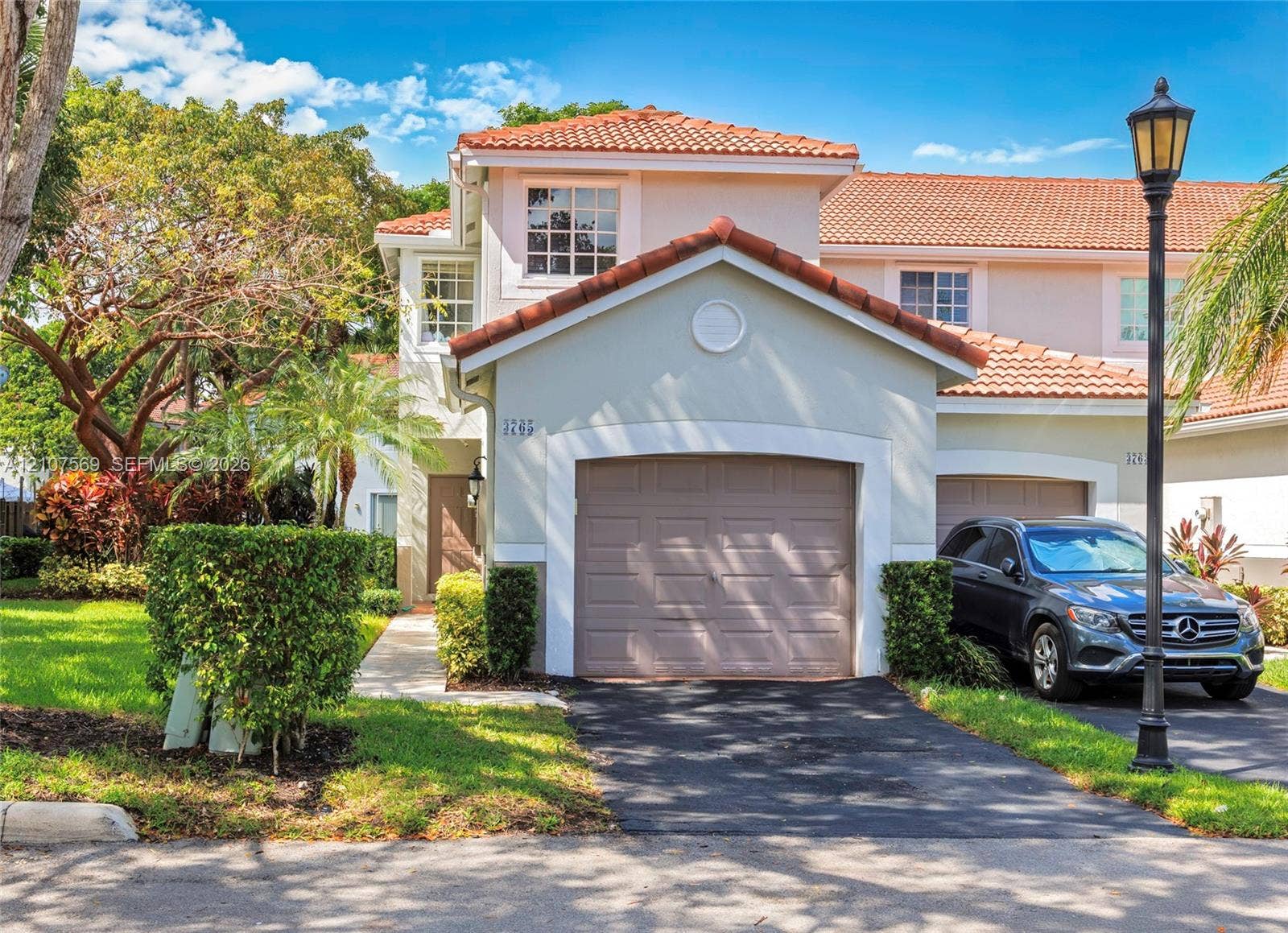 3765 San Simeon Circle, #3765, Weston, Weston, FL 33331 Two-story exterior featuring a clay tile roof, stucco facade, and an integrated single-car garage