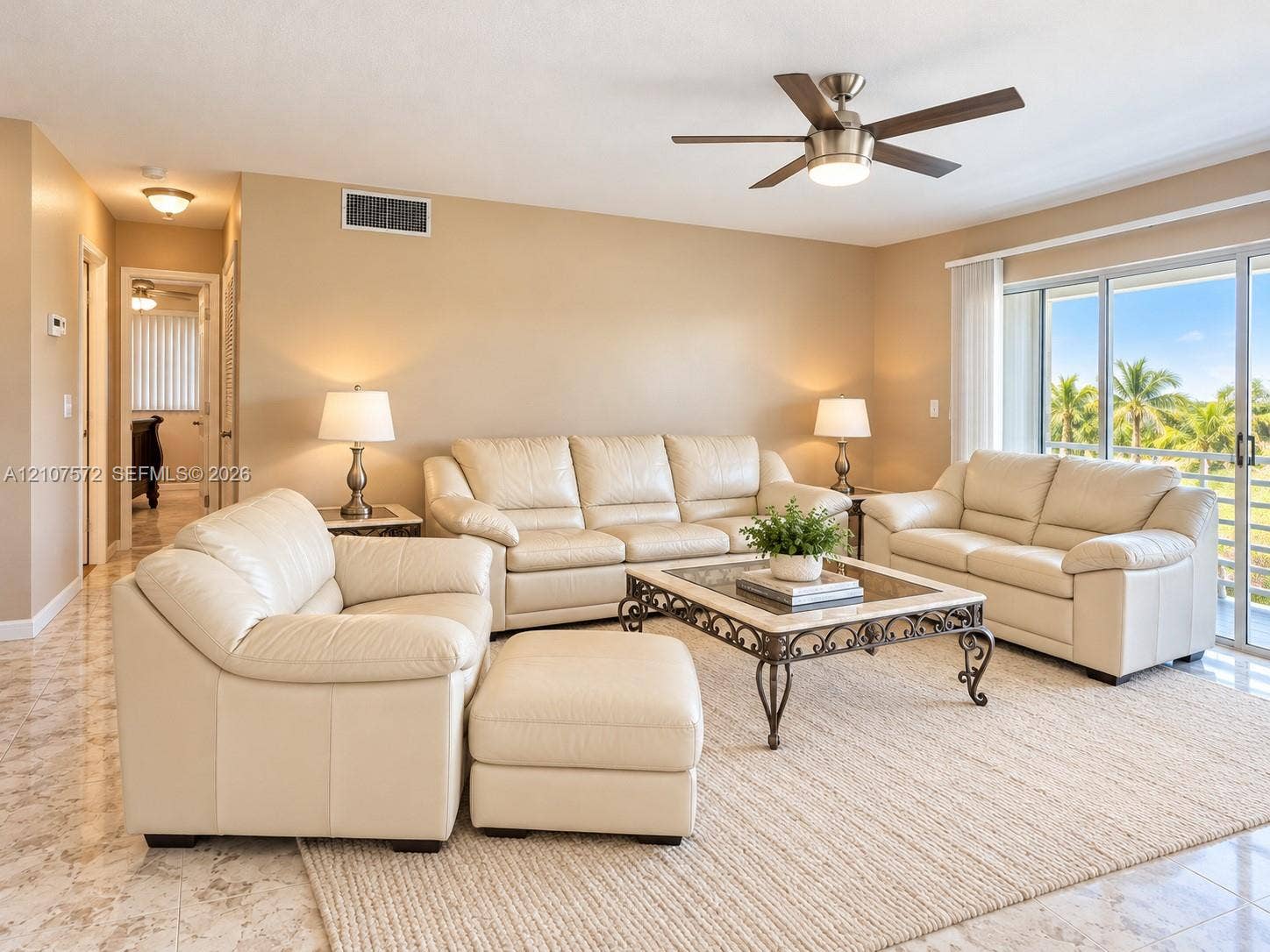 1425 Atlantic Shores Boulevard, #501, Hallandale Beach, FL 33009 Living area featuring tile flooring, a multi-blade ceiling fan with integrated light fixture,
