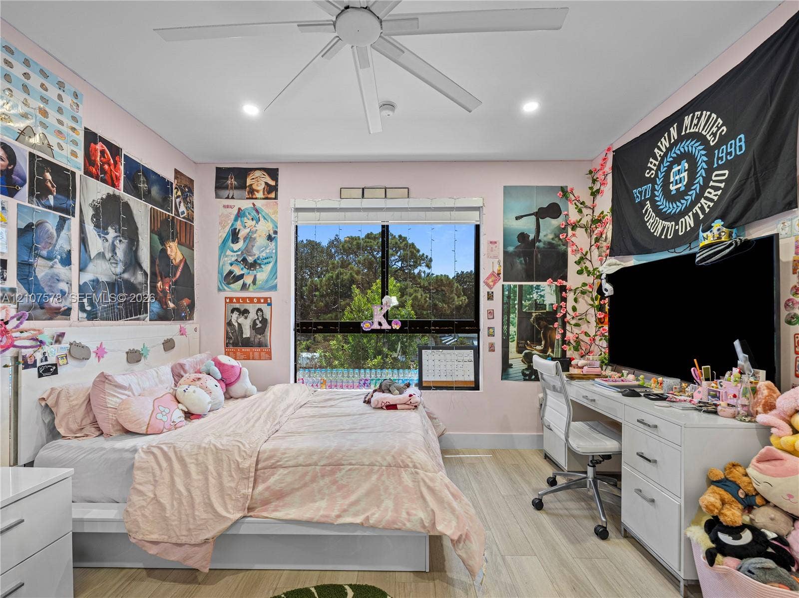 307 SW 10th Street, Fort Lauderdale, FL 33315 Bedroom featuring wood-finish flooring, a contemporary ceiling fan, recessed lighting, and a window with exterior scenery