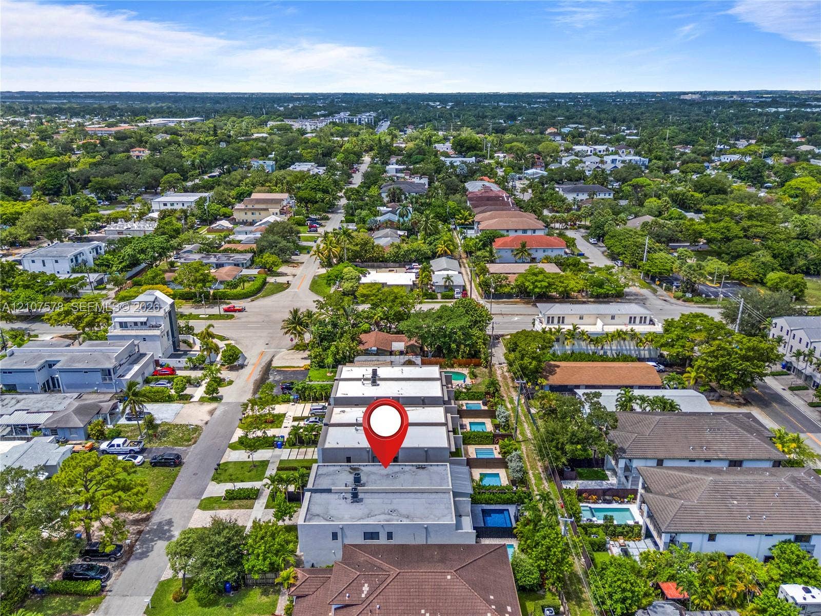 307 SW 10th Street, Fort Lauderdale, FL 33315 Aerial perspective of a multi-unit property featuring flat roofs and individual rear-set swimming pools