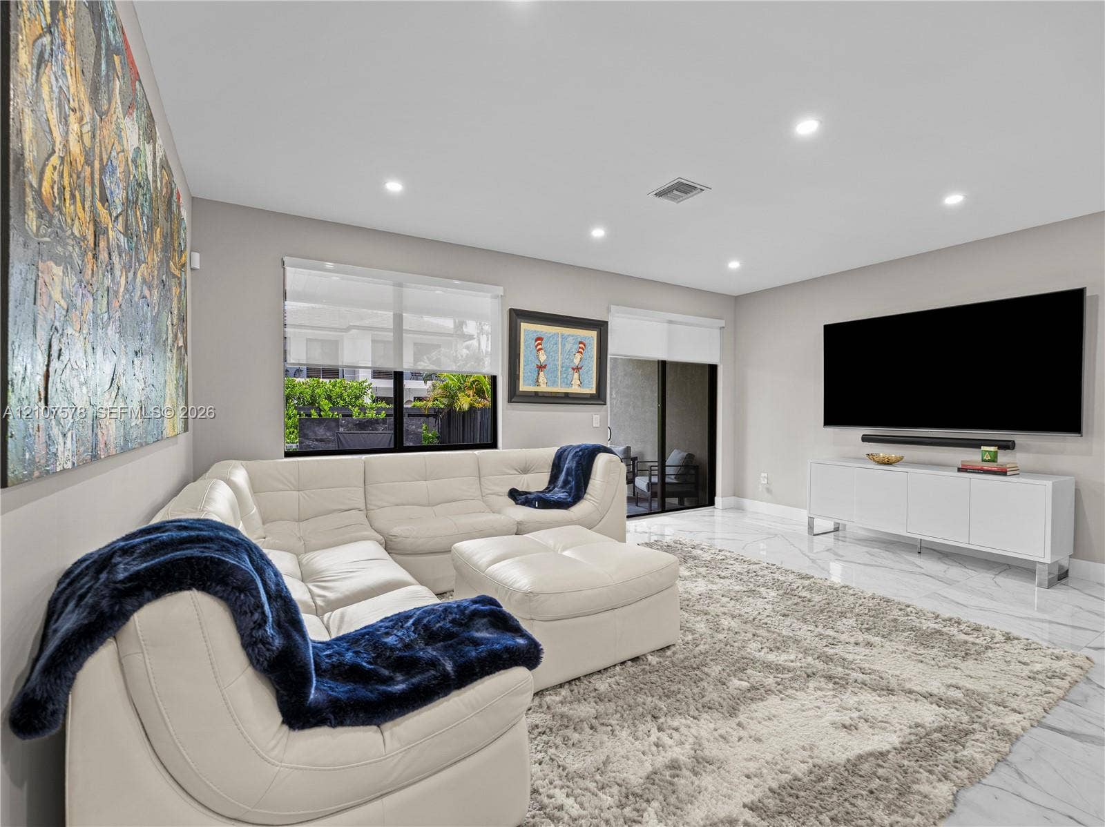 307 SW 10th Street, Fort Lauderdale, FL 33315 Large-format tile flooring, recessed lighting, and expansive sliding glass doors