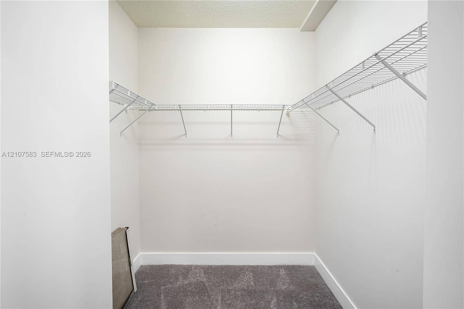 10270 NW 66th Street, #110, Doral, Doral, FL 33178 Storage area featuring grey carpeted flooring and white coated wire shelving