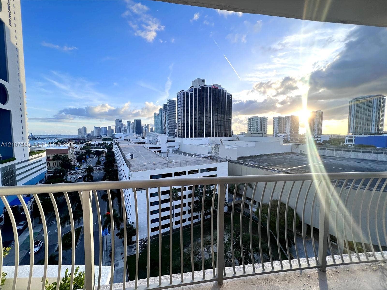 1750 N Bayshore Drive, #1218, Miami, Miami, FL 33132 Private balcony featuring a curved metal railing and panoramic city skyline scenery
