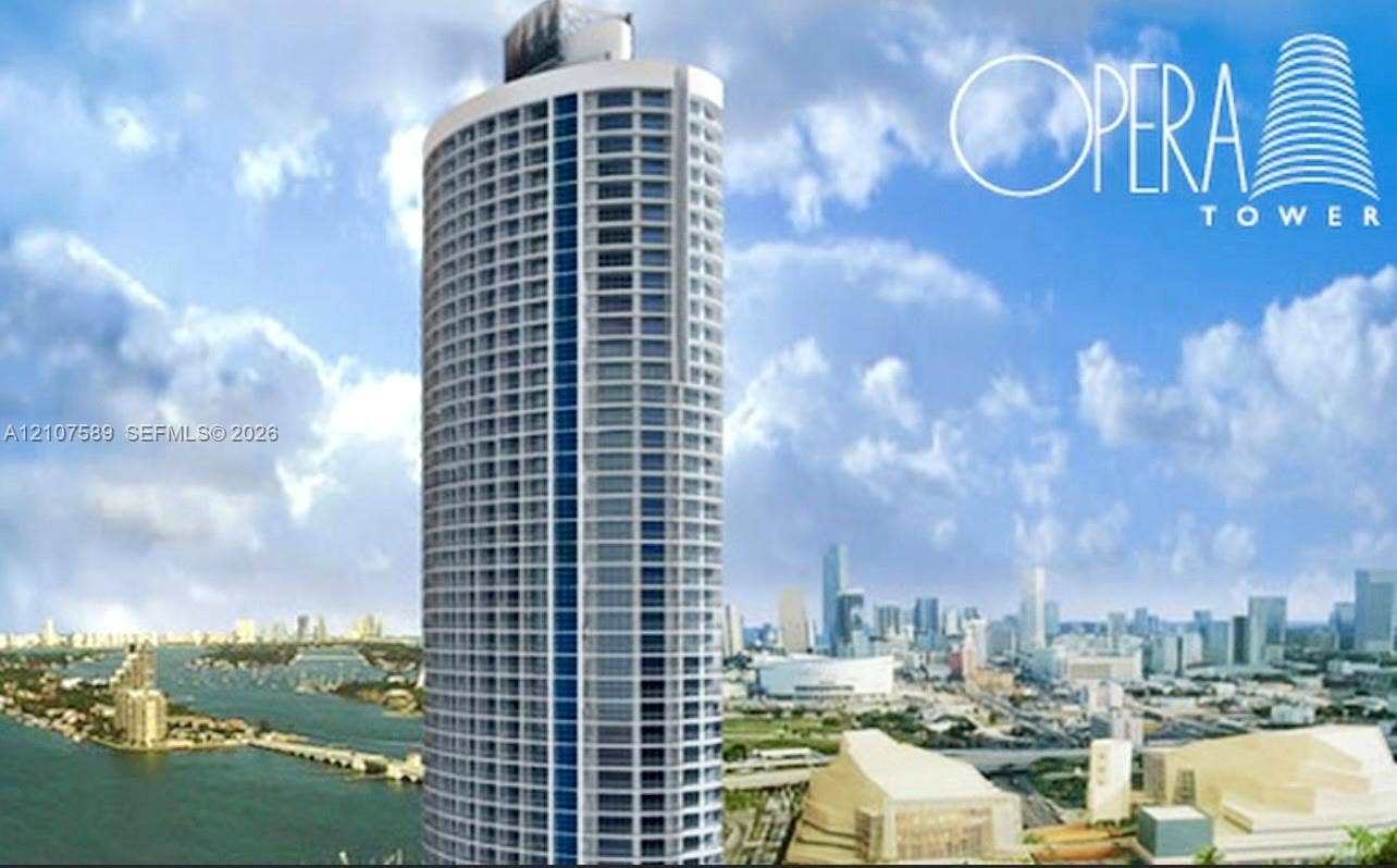 1750 N Bayshore Drive, #1218, Miami, Miami, FL 33132 High-rise residential tower featuring a cylindrical glass facade, external balconies, and structured concrete architecture