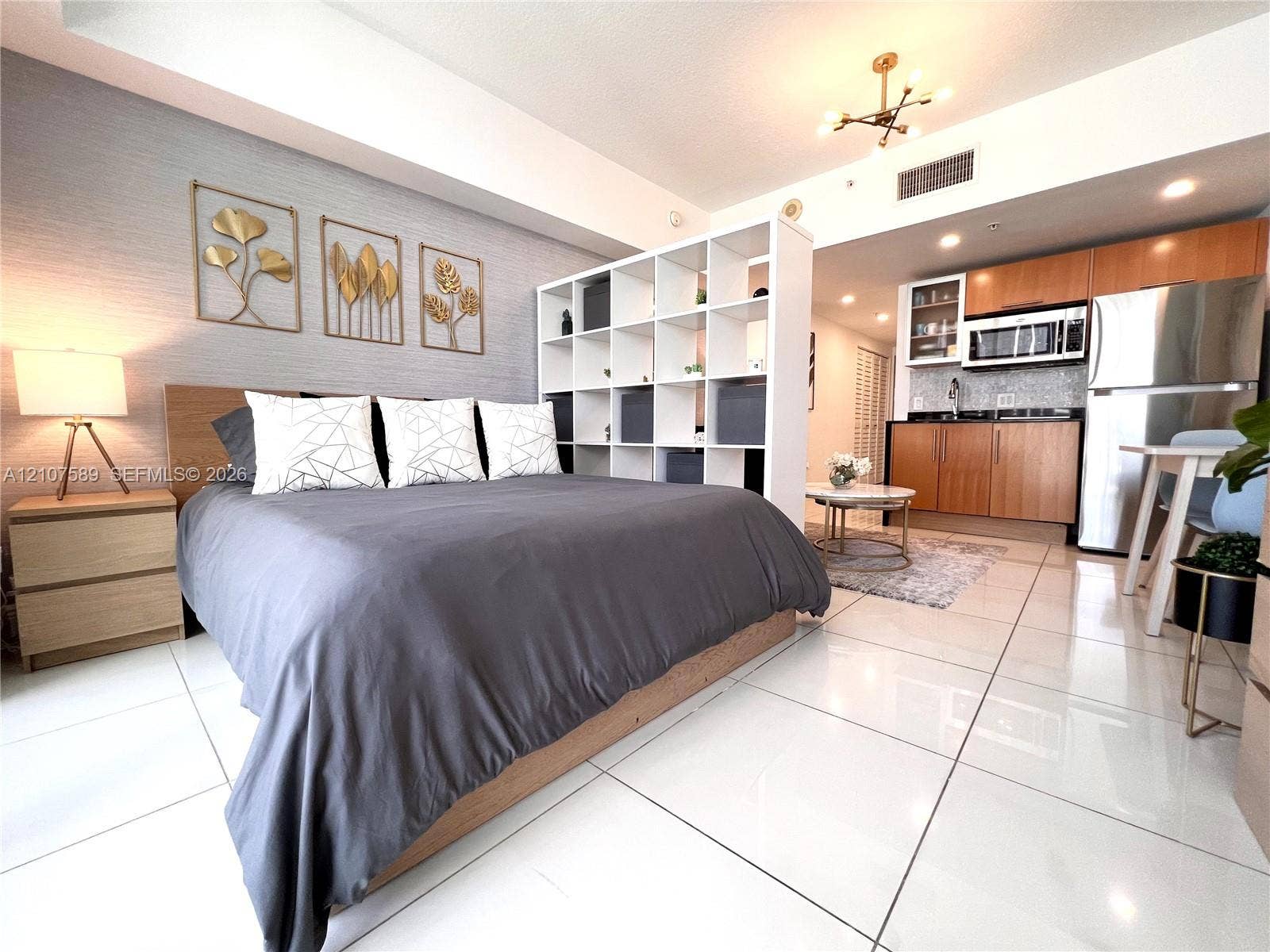 1750 N Bayshore Drive, #1218, Miami, Miami, FL 33132 Polished tile flooring, textured accent wall, and contemporary multi-arm ceiling lighting