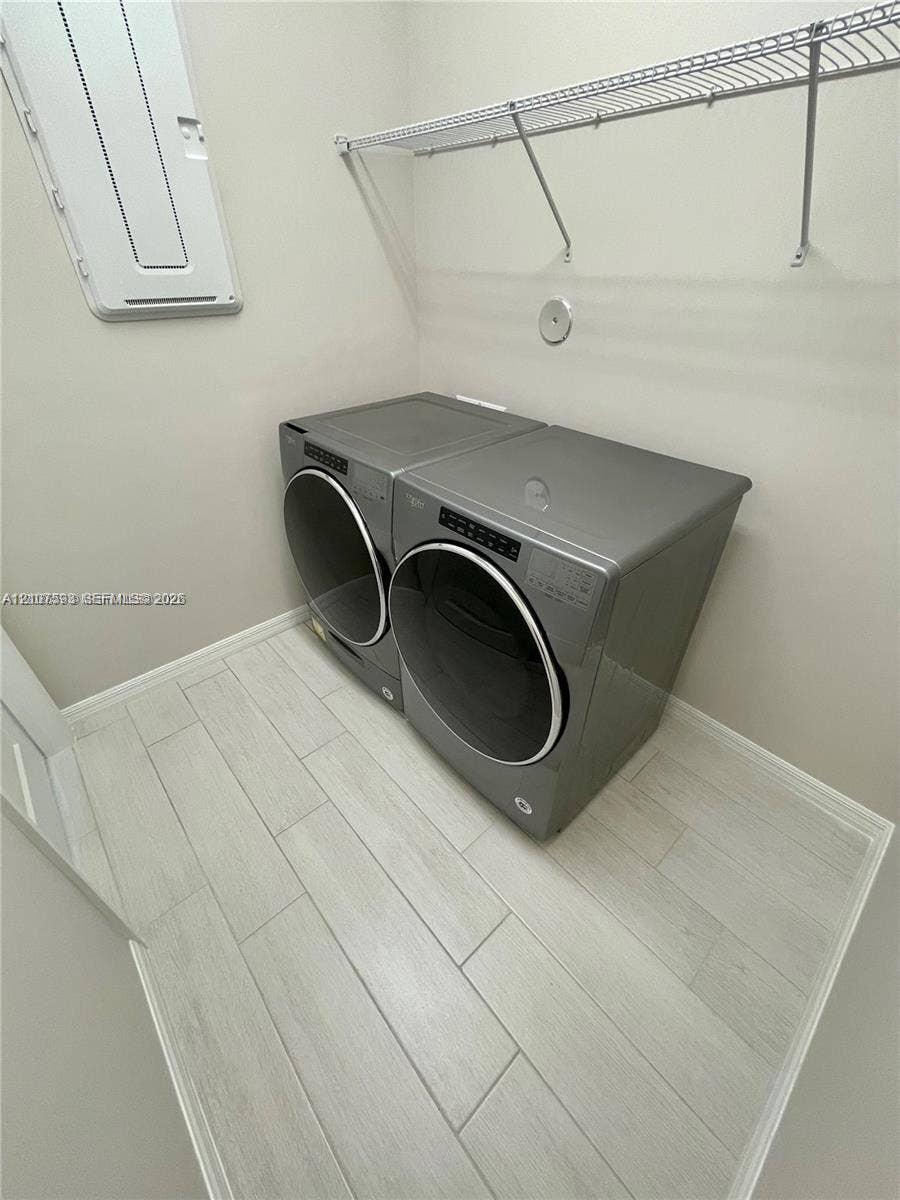 Wood-finish flooring, metal wire shelving, and neutral wall tones