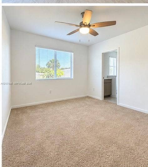 1088 NW 208th Terrace, Miami Gardens, FL 33169 Room featuring neutral carpeting, a ceiling fan with integrated lighting, and a single-pane window with horizontal blinds