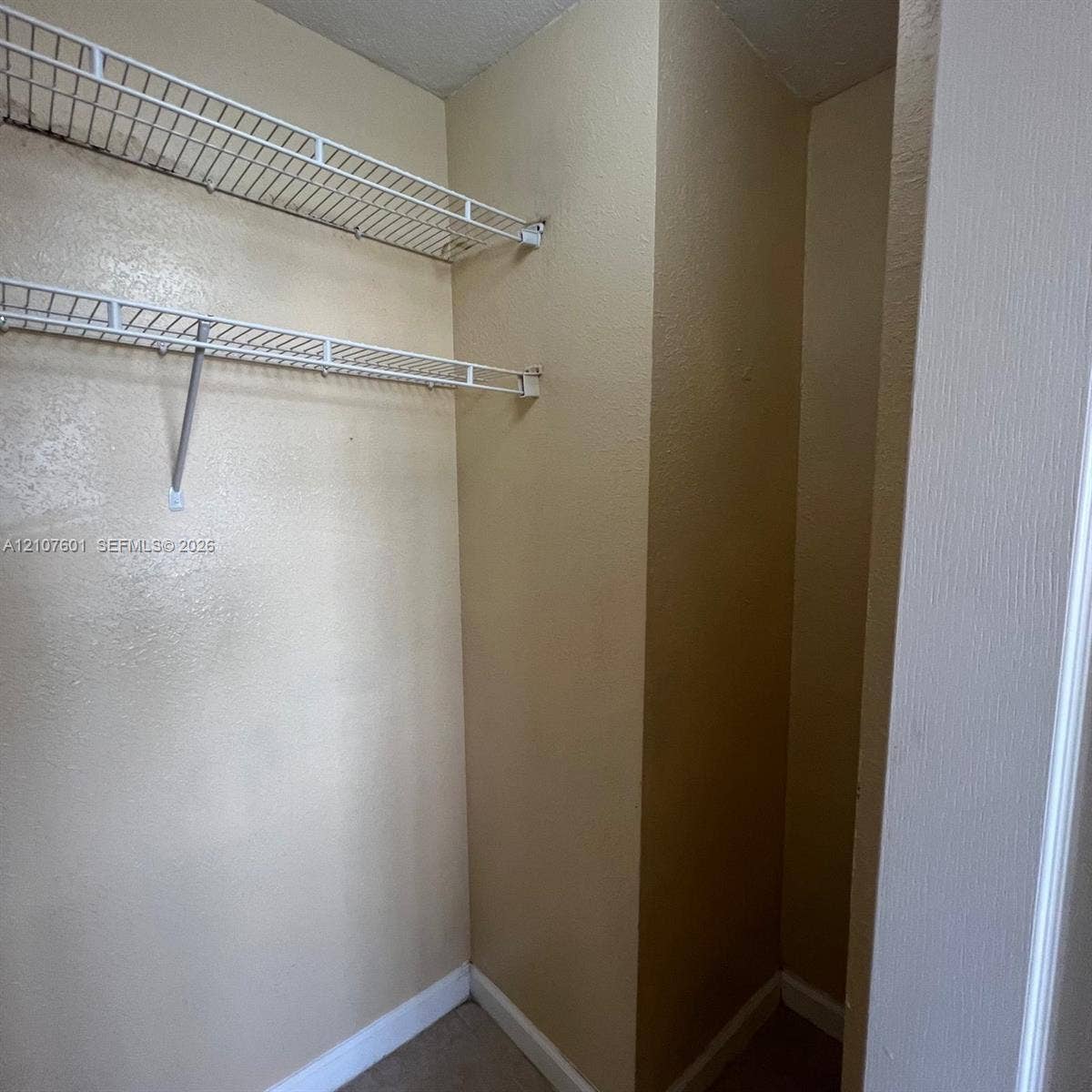 7080 NW 177th Street, #203-13, Hialeah, FL 33015 Storage closet featuring two levels of white wire shelving