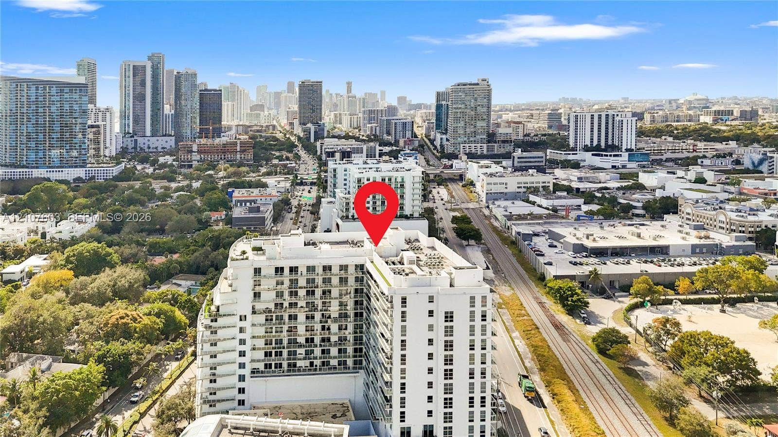 4250 Biscayne Boulevard, #1418, Miami, FL 33137 High-rise residential building featuring stacked private balconies and a flat-roof design