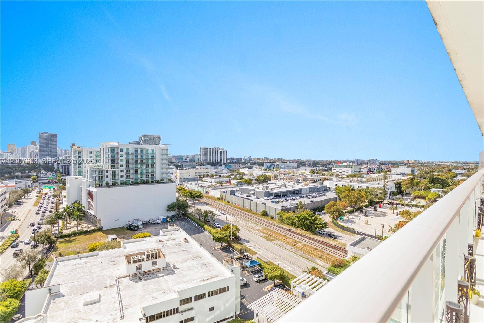 4250 Biscayne Boulevard, #1418, Miami, FL 33137 Private balcony with glass panel railing overlooking urban surroundings